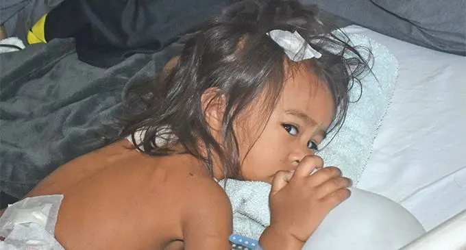 Dad Billy Singh at the Lautoka Hopsital with two-year-old daughter Amari Whippy. She had surgery on Friday for injuries she suffered when she was attacked streets >P12 by stray dogs in Narewa, Nadi. Photo: Mereleki Nai