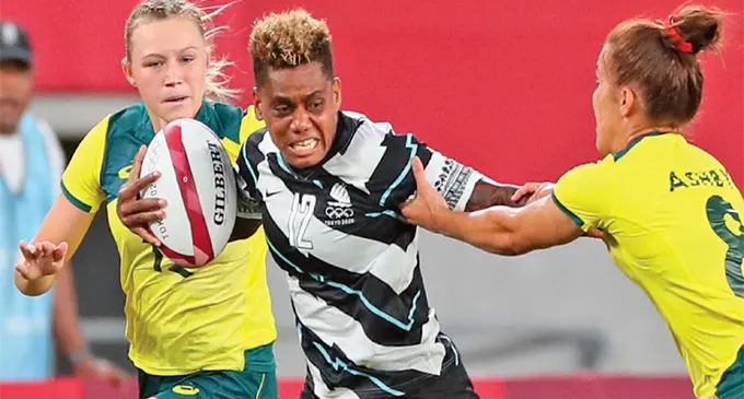 Team Fiji women’s rugby sevens forward Roela Radiniyavuni breaks away from an Australian tackler in the main quarterfinal of the Tokyo 2020 Olympic Games in Japan on July 30, 2021. Fiji upset the defending Olympic gold medal champions 14-12. Photo: Tokyo 2020 Olympic Games.