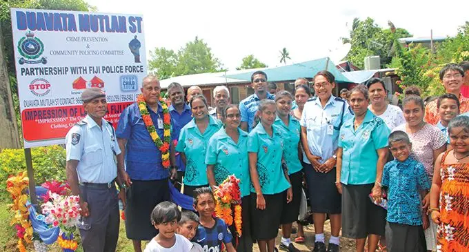 Mutlah Community Members in front of the first billboard with SP Lepani Liga (second from left). Photo: Fiji Police