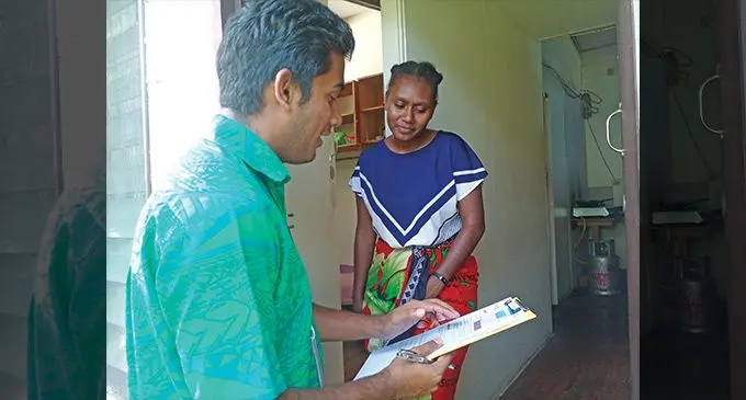 Fijian Competition and Consumer Commission officer noting tenant Dorah Yaviong’s feedback on April 14, 2023. Photo: Jone Salusalu