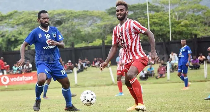 Labasa striker Siotame Kubu passes the ball as Lautoka’s Epeli Rokotuva closes in at Subrail Park, Labasa, on October 24, 2020. Navua take on Lautoka next. Photo: Renu Radhika