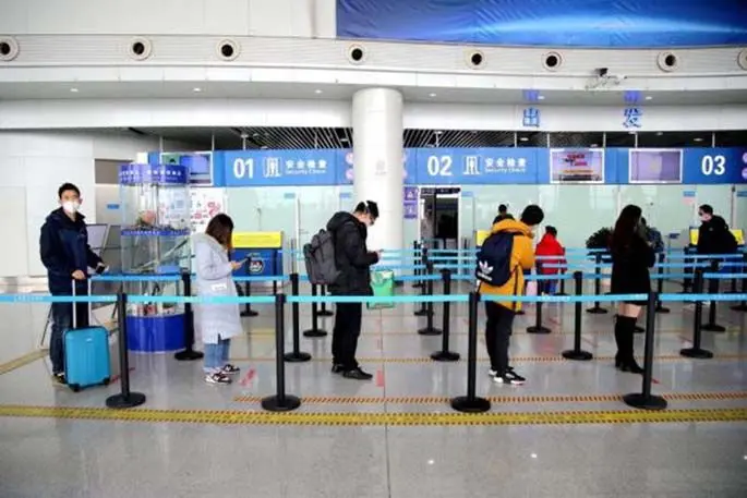 Passengers prepare for boarding at Wudangshan Airport in Shiyan, central China's Hubei Province, March 29, 2020. (Photo by Cao Zhonghong/Xinhua)