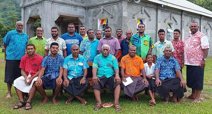 President of the Methodist Church of Fiji Reverend Ili Vunisuwai ( Sitting- Fourth from left) with Nakaugasele villagers at Nakoronawa Village in Nakasaleka, Kadavu. Photo: Wati Talebula-Nuku.