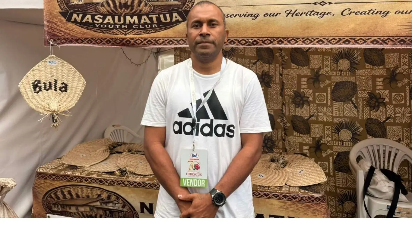 Isireli Gumatua manages the youth group's business stall during Day 3 of the FMF 70th Hibiscus Festival at Albert Park in Suva on August 31, 2026.