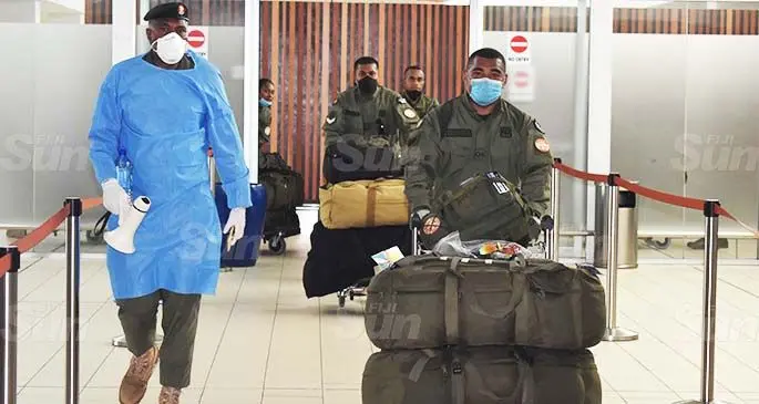 RFMF officers return from peacekeeping dutiies at the Nadi International Airport yesterday. Photo: Waisea Nasokia 