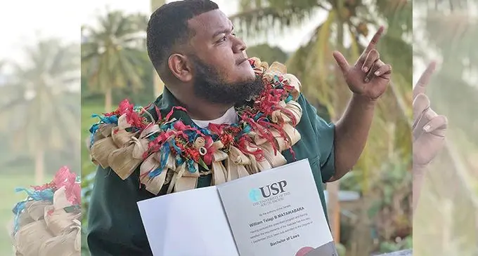 William Mataikabara with his degree from the University of the South Pacific.