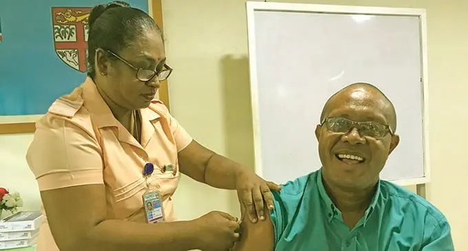 Labasa Hospital laboratory technician officer Timoci Rasolo gets vaccinated by Director Nursing of Labasa Hospital, Suman Lata Raman, at the Labasa Hospital Conference room on March 11,2021. He is the first in the Northern Division to receive the AstraZeneca shot. Photo: Laisa Lui