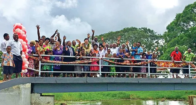 The Ambassador of Japan to the Republic of Fiji Masahiro Omura with happy villagers after the opening of the Visama Village foot bridge in Nakelo, Tailevu.