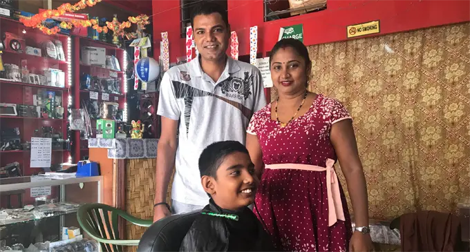 Avinesh and Sheetal Singh (standing) inside their shop in Rakiraki town. Photo: Lusiana Banuve
