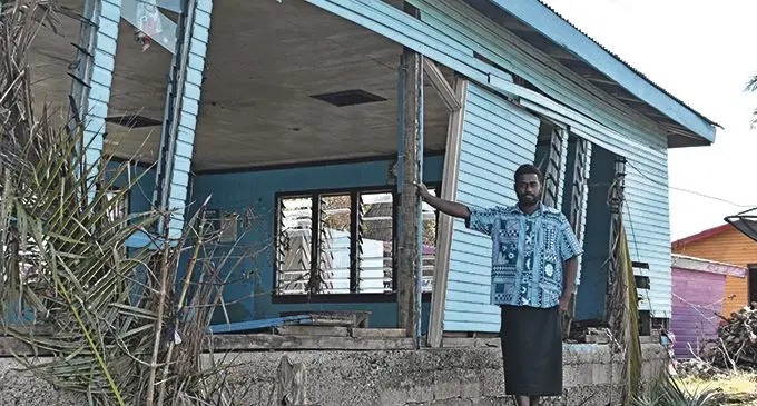 Nakawaga Village headman Henry Koliniwai outside the village hall that was damaged by storm surges.  Photo: Laisa Lui