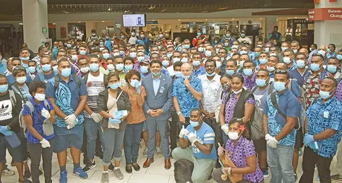 Attorney-General Aiyaz Sayed-Khaiyum, Australian High Commissioner John Feakes, Minister for Employment Parveen Bala (middle) with the 172 workers leaving for Australia at the Nadi International Airport on November 25, 2020. Photo: Waisea Nasokia
