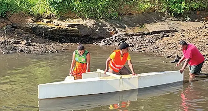Participants trying out the new canoe which they build during the workshop 