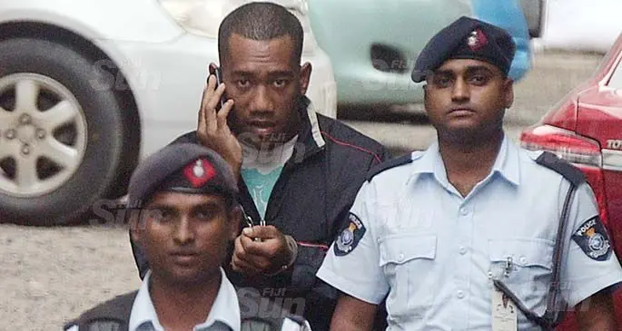 Accused Livai Ravono, 24, escorted to the Suva Court by Police officers on July 1, 2020. Photo: Ronald Kumar