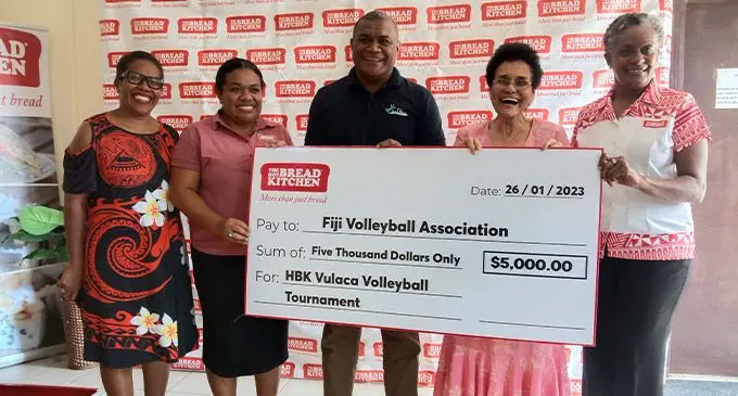 Fiji Volleyball Federation president Kemueli Naiqama (third from right) receives the cheque from Hot Bread Kitchen founder Mere Samisoni (second from right) with staff at the Hot Bread Kitchen main office in Wailada, Lami, on January 25, 2023. Photo: Sereana Salalo