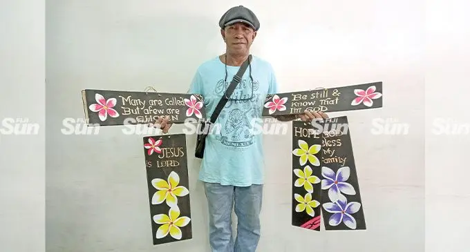 Woody Waraqe with his free-hand carved wall hanging in Lautoka on July 7, 2022. Photo: Nicolette Chambers