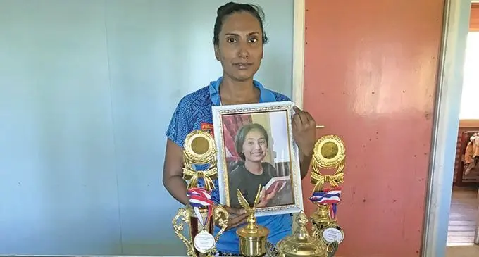 Mum Rohini Lal with a photo of her daughter Jiya Jaanvi and her school awards.  Photo: Ivamere Nataro