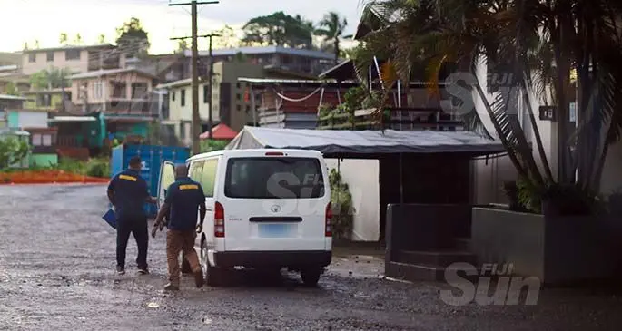 Fiji Immigration Department officers after retrieving the passports of Bangladeshi employees from the company’s head office. Photo: Kelera Sovasiga