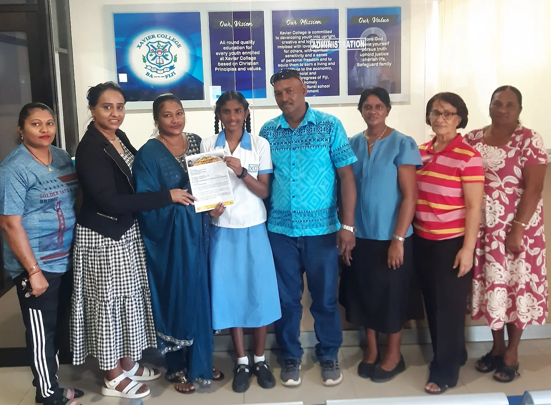 Year 10 Xavier College student Trisha Lal with her family.