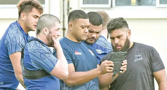 Bay of Plenty and Flying Fijians prop Haereiti Hetet (right) with team-mates. Photo: Radio NZ