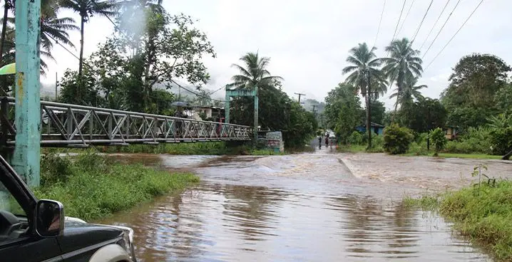 The bridge connecting Qauia Settlement to the main road is underwater. Photo: File