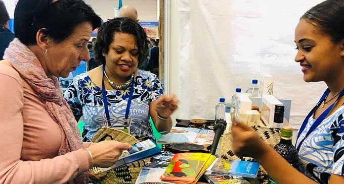 Fiji team explain to a visitor on Fijian products at the International Mediterranean Tourism Market 2019 Exhibition.