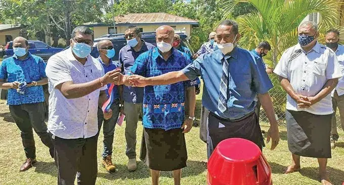 Minister for Agriculture, Waterways and Environment, Mahendra Reddy (front, from left) hands over the tractor key to representatives of Nakovacake Cluster Farmers. Photo: DEPTFO News