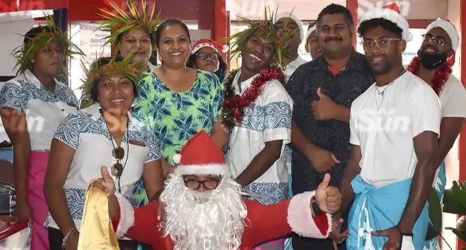 Radisson Blu Resort Fiji staff members with staff members of the Fiji Sun office in Nadi.