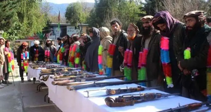 Islamic State (IS) militants take part in a surrender ceremony in Kunar province, Afghanistan, March 1, 2020.(Xinhua/Emran Waak)