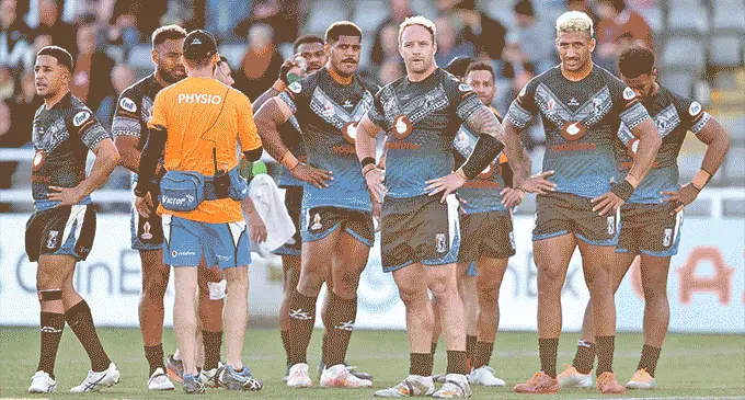 From left: Ben Nakubuwai, Maika Sivo, Tui Kamikamica, Korbin Sims, Api Koroisau, Viliame Kikau and Semi Valemei during a break against Italy. Photo: FNRL.