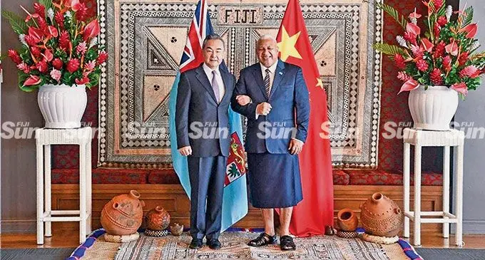 Chinese Foreign Minister Wang Yi and Prime Minister Voreqe Bainimarama. Photo: DEPTFO News