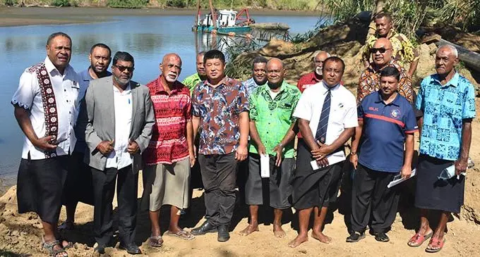 The Minister for Agriculture, Waterways and Environment Dr Mahendra Reddy (third from left), Na Momo Levu Na Tui Nadi, Ratu Vuniani Navuniuci (fourth from left), Hong  Yuan Development Pte Limited director, Yuan Gao (sixth from left) with the other dignitaries and Nadi villagers near the Nadi River on August 9, 2022.  Photo: Nicolette Chambers.
