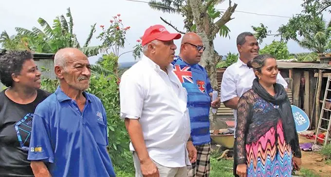 Prime Minister Voreqe Bainimarama (third from left) during his visit to Vunivivi Settlement in Nausori after visiting places that were affected by TC Cyclone Sarai on December 29, 2019. Photo: Ilaijia Ravuwai