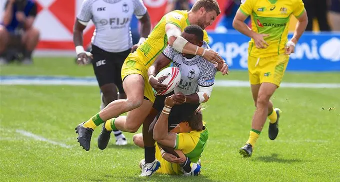 Fiji Airways Fijian Sevens playmaker Waisea Nacuqu cops a high shot from Australian skipper Lewis Holland at the USA Sevens in Las Vegas on March 3, 2019. Nacuqu left the field with a fractured collarbone in the opening minutes. Holland stayed on and played a key part in Australia’s win.  Photo: Ian Muir