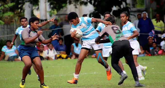 Loata Kabulevu (with ball) of St John’s College Under-16 side tries to evade a tackle against Levuka Public School at Nasau Park in Levuka on July 29, 2022. The warm-up match was part of their preparation for the Eastern Zone’s Weet-bix Raluve Trophy competition, which gets underway this weekend. Photo: Manhar Vitha