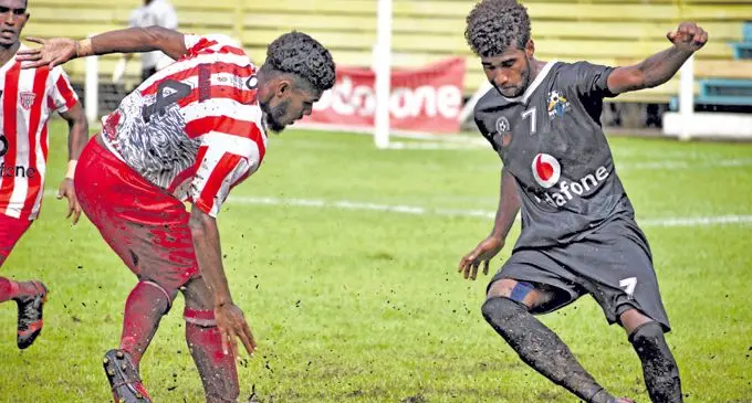 Labasa player Sitiveni Rakai tries to defend the ball against Ba player Samuela Nabenia at Subrail Park March 3, 2018. Photo: WATI TALEBULA