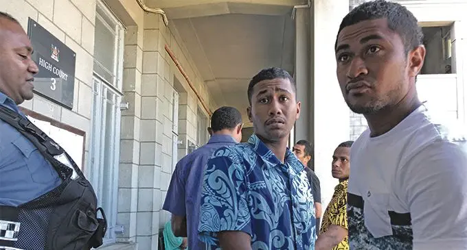 Josua Bueta (in blue shirt) and Molitoni Vunivavalagi (in white t-shirt) outside the High Court in Suva on April 4, 2019. Photo: Ashna Kumar