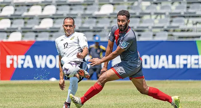 Fiji’s Tevita Waranivalu (left) in action against New Caledonia. Photo: OFC Media