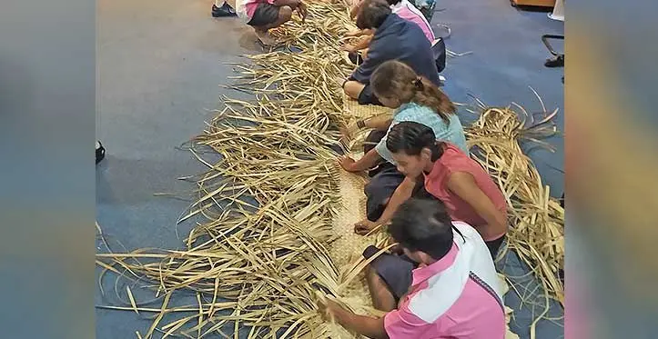 International School Suva students learning the traditional art of weaving. Photo: International School Suva.