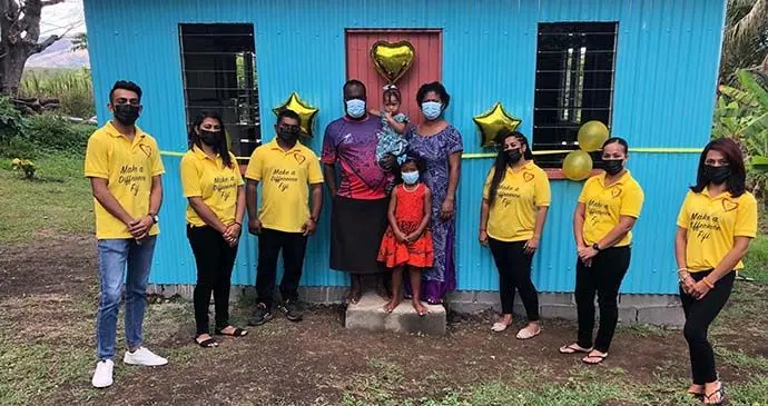 Mesulame Domonakibau, with wife Esita Lotu, daughters Mereoni and Lilieta with Team MADF in front of their new home in Navoli, Ba.