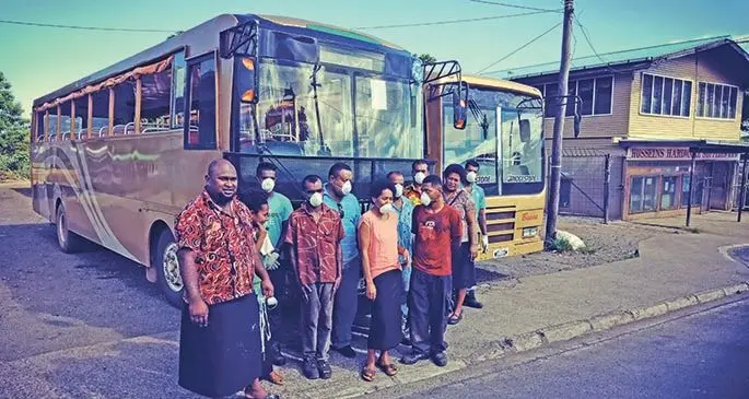 Taveuni Buses PTE Limited staff members wear masks on Taveuni Island on March 26, 2020.