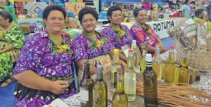 Women display homemade virgin oil and coconut oil products at the Women’s Expo at the Vodafone Arena on March 7, 2025. Photo: Sosiveta Korobiau