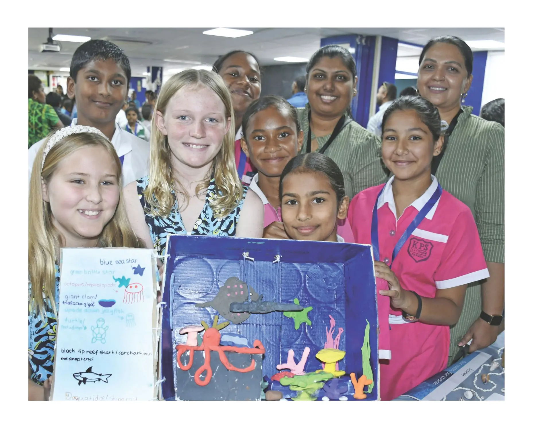 International Primary School students Harriet Nightingale and Scarlett Pack with visiting Kulukulu Public School students on June 3, 2026, during the Veivueti Kids Ocean Conference.