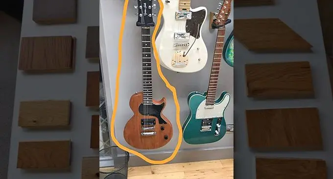 Fiji mahogany samples. Right is the guitar made from Fiji mahogany displayed in the United Kingdom
