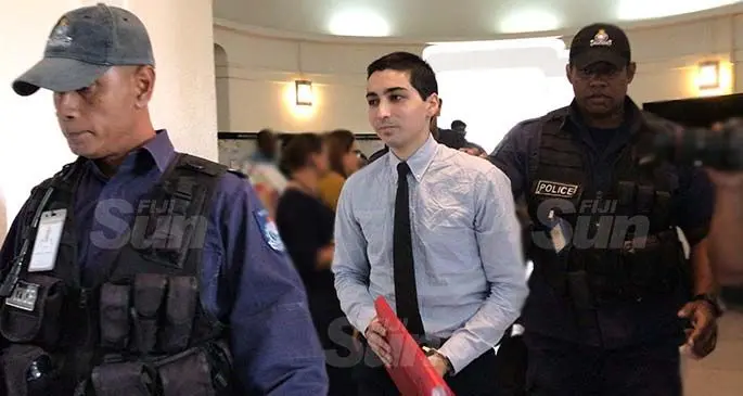 Joshua Aziz Rahman escorted by Police officers from the Police Special Response Unit at the High Court in Suva on April 16, 2021. Photo: Ashna Kumar