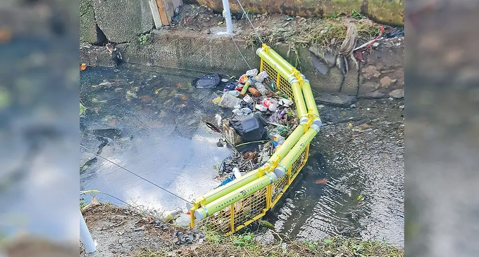 A Trash Boom at a creek at Moala Settlement in Nadera. 