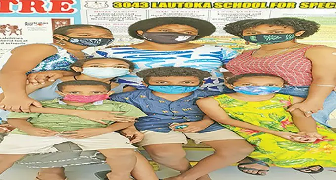 Sereana Qionilase (back row, middle) standing with her two daughters, Ruth (left) and Elenani (right). Sitting are her four other children, from left: Naomi, Luke, Mesake Junior and Faith.