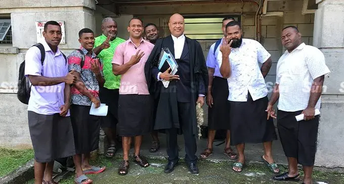 From left: Pita Raikoso, Josefa Bureta, Apisai Naqama, Nemani Vasuvulagi, Waisea Sadranu (back) , their lawyer David Toganivalu,  Joji Ragamate (blocked), Josefa Satini, and Isei Rakoso outside the High Court in Suva on September 14, 2022. Photo: Ashna Kumar