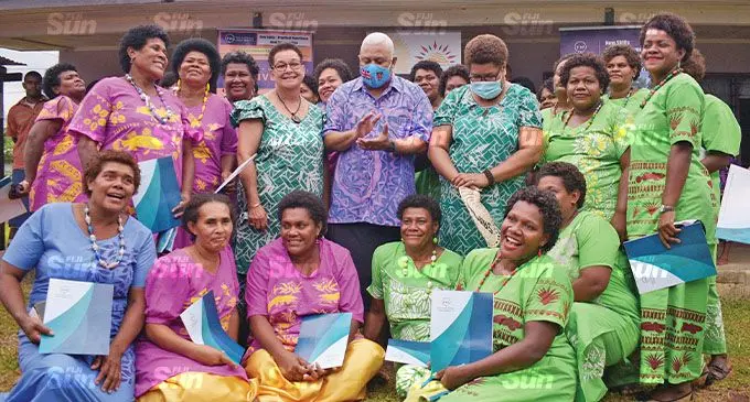 Prime Minister Voreqe Bainimarama with Fiji National University lecturer Sereana Naulivou, guests and graduates of the rural women entrepreneurship pilot training project at Nairukuruku, Matailobau, Naitasiri on November 26, 2021. Photo: Ronald Kumar