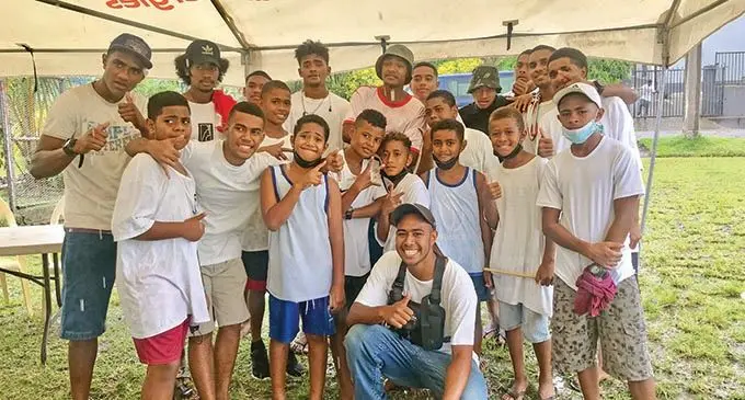 Enele Ma’afu (front crouching) and the team with children of Cunningham Stage 4 who will be assisted with the proceeds collected from the barber drive.  Photo: Inoke Rabonu