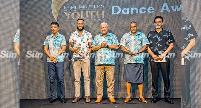 Apakuki Nalawa (second from left) with the Music and Dance award flanked by Permanent Secretary of Ministry of Commerce & Trade, Tourism and Transport Shaheen Ali (far left) , Prime Minister Voreqe Bainimarama and Minister for Commerce, Trade, Tourism and Transport, Faiyaz Koya and RC Manubhau director Ashok Patel during the Prime Ministers Youth Awards at the Grand Pacific Hotel on May 6,2022. Photo: Leon Lord.